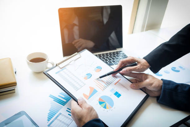 istock Businessman Working At Desk In Office 910895332