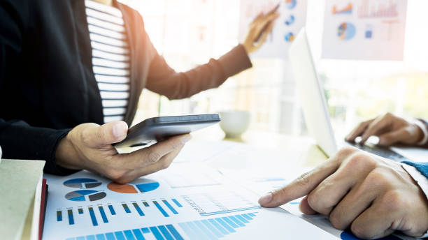 istock Business People Working At Desk In Office 910895952