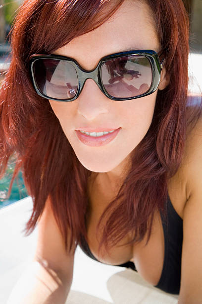 istock Beauty redhead with sunglasses 91089664