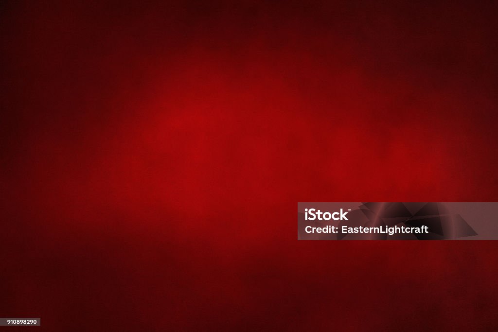 Red Mottled Abstract Background red mottled abstract dark and moody background with a messy, grunge, vintage feel with a hint of noise added to create texture with copy space Red Stock Photo