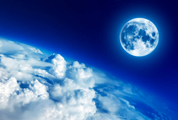 istock Sky clouds below the moon, moon image furnished by NASA 910903854