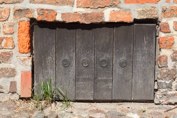 istock old cellar window rammed with wooden boards 910904280