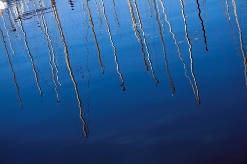 Reflections of masts in the sea surface