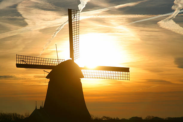sunrise ветряная мельница - polder windmill space landscape стоковые фото и изображения