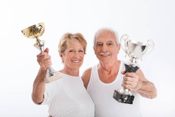 istock senior couple with trophies 910919964