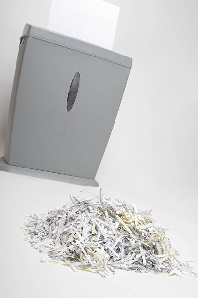 istock Shredded Paper with Shredder in Background 91092346