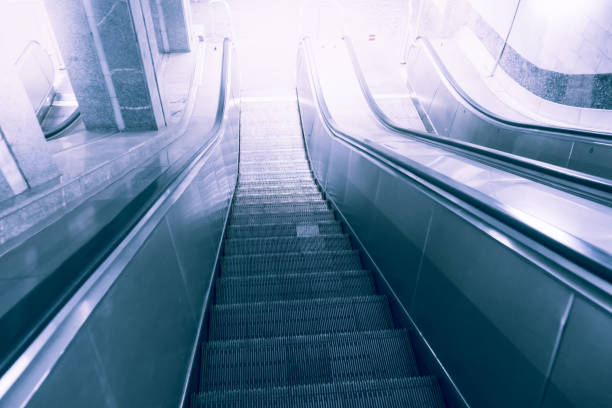 escalator, up and down escalators in public building or metro subway