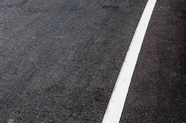 istock White line on new asphalt detail 910925252