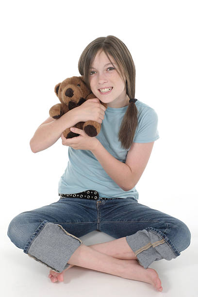 istock Little Girl Holding Teddy Bear 91094279