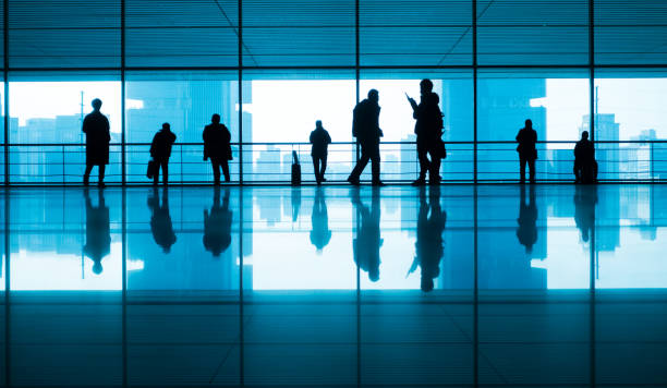 istock People walking reflection in airport corridor 910943010