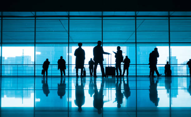 istock travellers walking in modern airport hallway 910943110