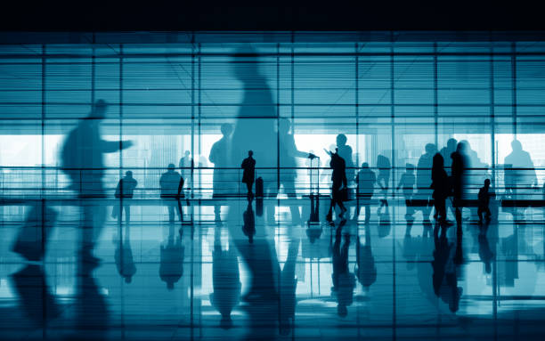 istock travellers walking in corridor 910943450