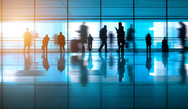 istock People walking reflection in airport corridor 910943530