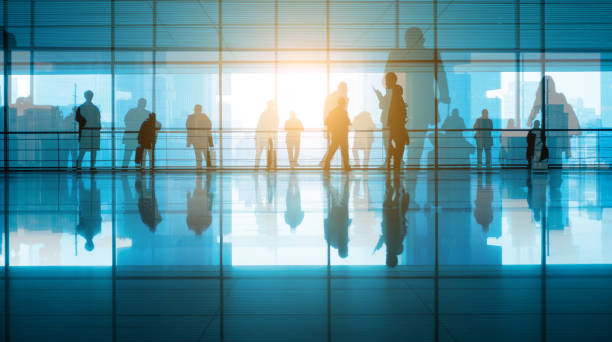 istock travellers walking in modern airport hallway 910943626