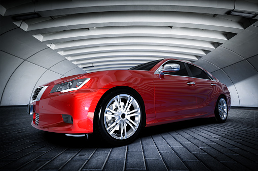 Modern red metallic sedan car in urban setting - tunnel. Generic desing, brandless. 3D rendering.