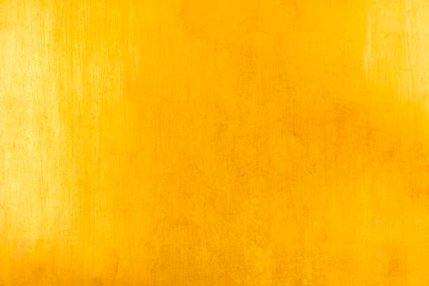 istock Shiny yellow leaf gold foil texture background 910943998