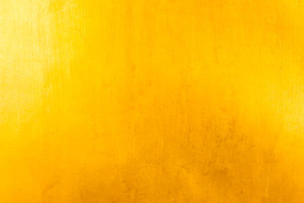 istock Shiny yellow leaf gold foil texture background 910944276