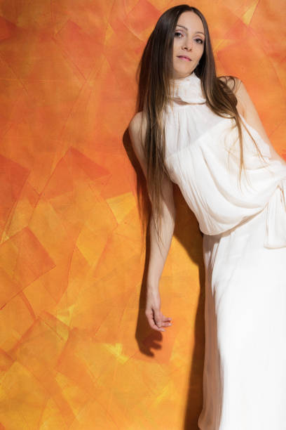 istock Woman with soft white dress 910945284