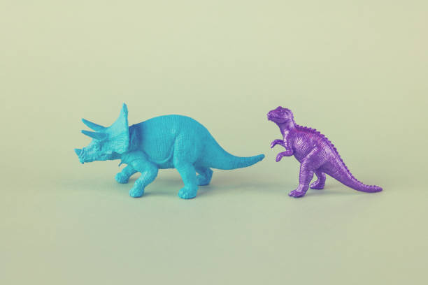 Colorful Toy Dinosaurs on Green