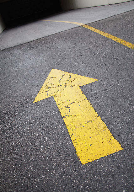 istock Arrow In Wet Driveway 91095652