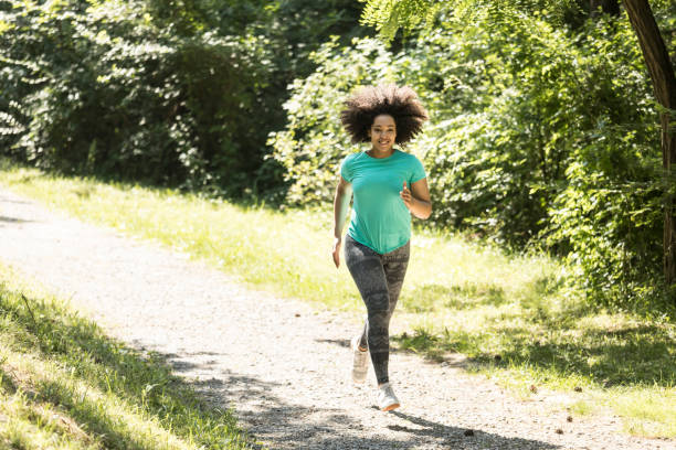 istock African woman jogging in park 910974030