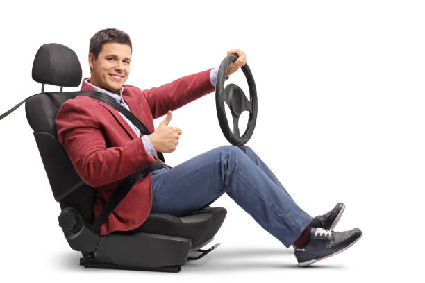 istock Elegantly dressed man seated in a car seat driving and making a thumb up sign 910982234