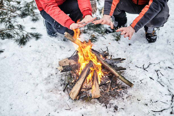 istock Tourists on a halt in the winter forest 910984016