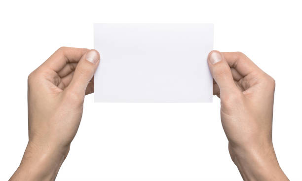 istock Empty white A6 postcard horizontally. Man holding a template isolated in his hands 910984606
