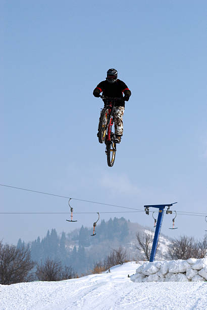 Extreme biker fly on big air stock photo