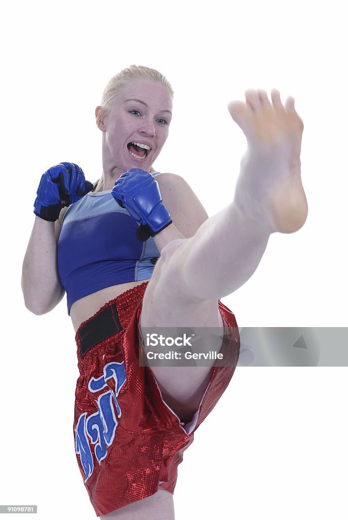 Kicking maneuvers Mixed martial artist kicking. Adult Stock Photo