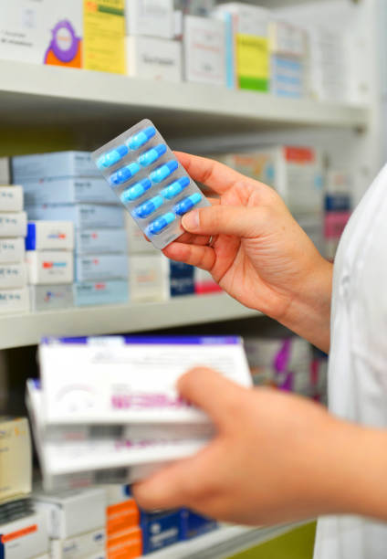 istock Pharmacist holding medicine box 910990552