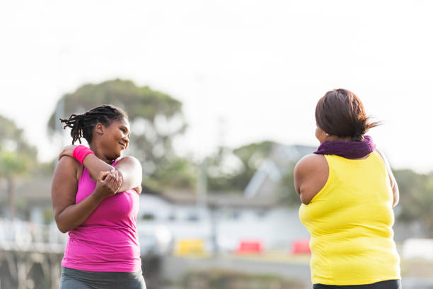 istock Women exercising outdoors 910994754