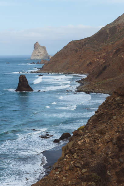 istock Remote beaches on coastline next to the mountains with crashing waves in ocean 910994836