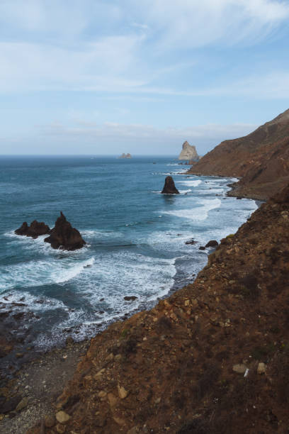 istock Remote beaches on coastline next to the mountains with crashing waves in ocean 910994850
