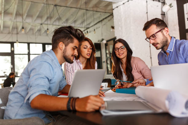 istock Group of casual business people working on new project 910994868