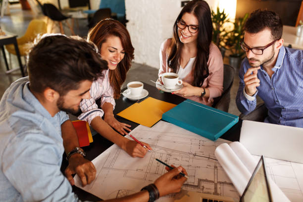 istock Group of casual business people working on new project 910994984