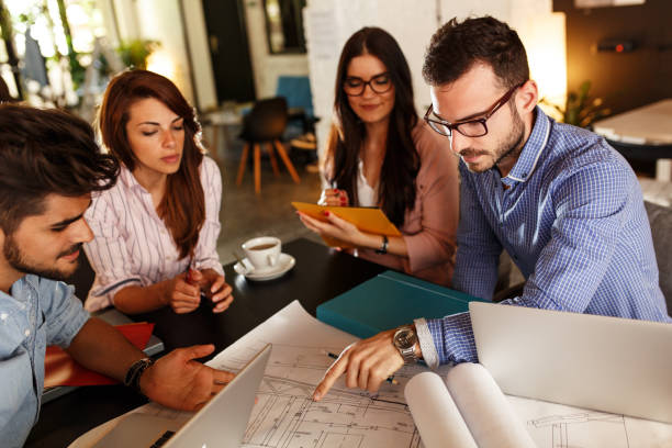 istock Group of casual business people working on new project 910995548