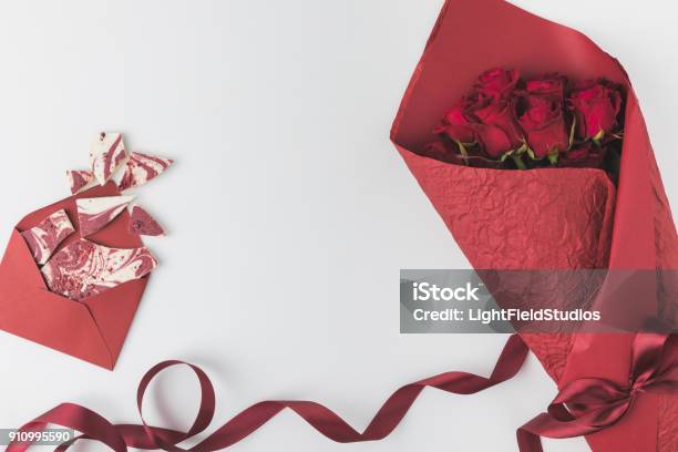 Flat Lay With Bouquet Of Roses Ribbon And Envelope Isolated On White St  Valentines Day Holiday Concept Stock Photo - Download Image Now - iStock