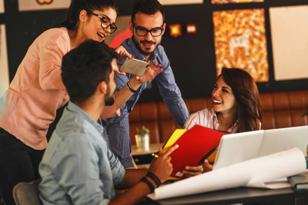 istock Group of casual business people working on new project 910995998