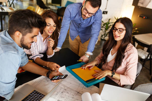 istock Group of casual business people working on new project 910998268