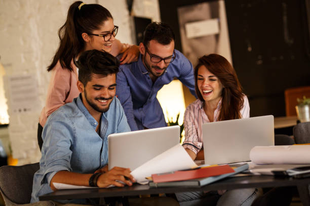 istock Group of casual business people working on new project 910998676
