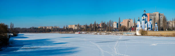 The frozen and snow-covered river Southern Bug and the Temple of the Holy Virgin (Ukraine, Vinnitsa) The frozen and snow-covered river Southern Bug and the Temple of the Holy Virgin (Ukraine, Vinnitsa) vinnytsia photos stock pictures, royalty-free photos & images