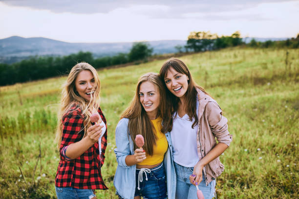 istock Three girlfriends taking a walk in the nature. 911008586