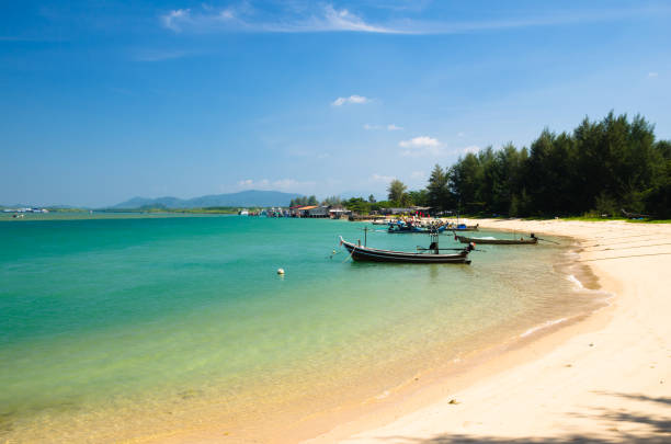istock Boat at beach and blue sky 911011488