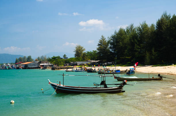 istock Boat at beach and blue sky 911011514