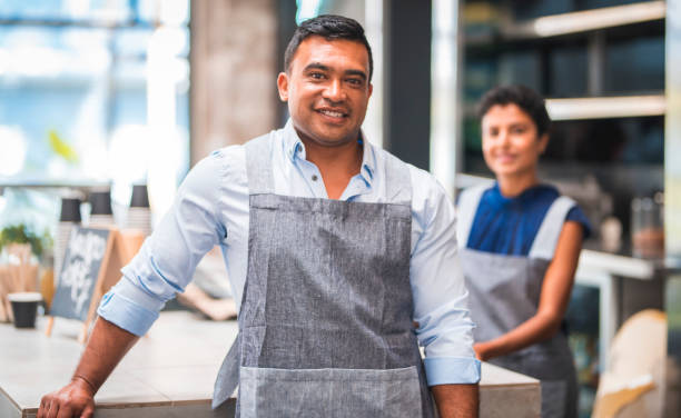 istock Manager looking at camera at coffee shop 911011576