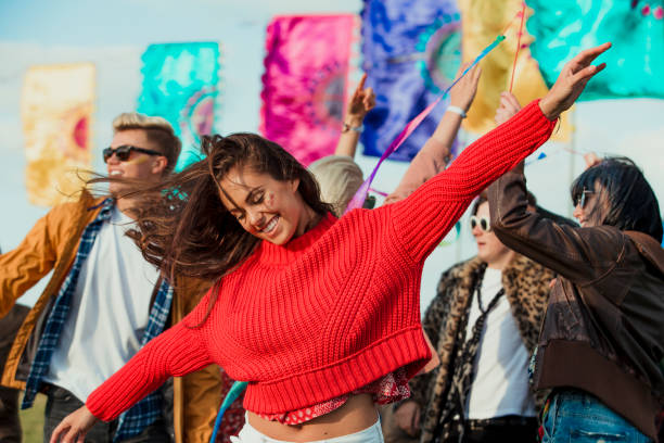 Dancing at a Music Festival Group of friends dancing and having fun at a music festival. live performance stock pictures, royalty-free photos & images