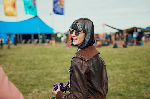 Young woman having fun at a music festival.