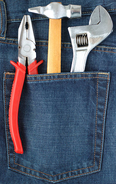 Toolkit in jeans pocket stock photo
