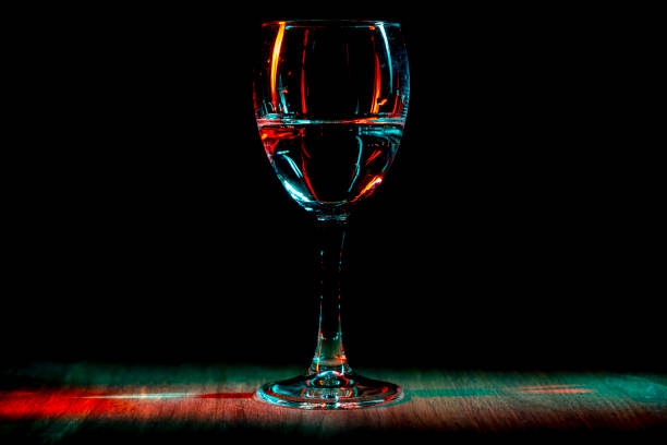 istock A glass of wine night club. The light effect. 911015976